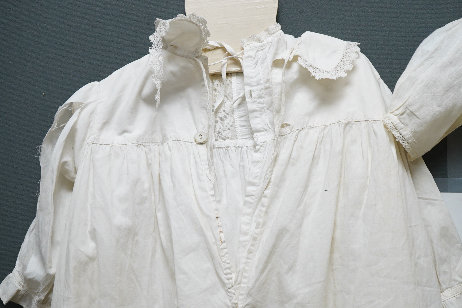 Three 20th century baby’s cotton and machine lace night-dresses